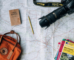 Photo of map and travel items representing uk travel