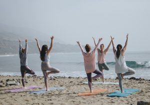 staying healthy yoga on the beach for taylor hampton solicitors UK immigration article