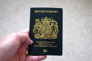 A picture of someone holding a new UK passport